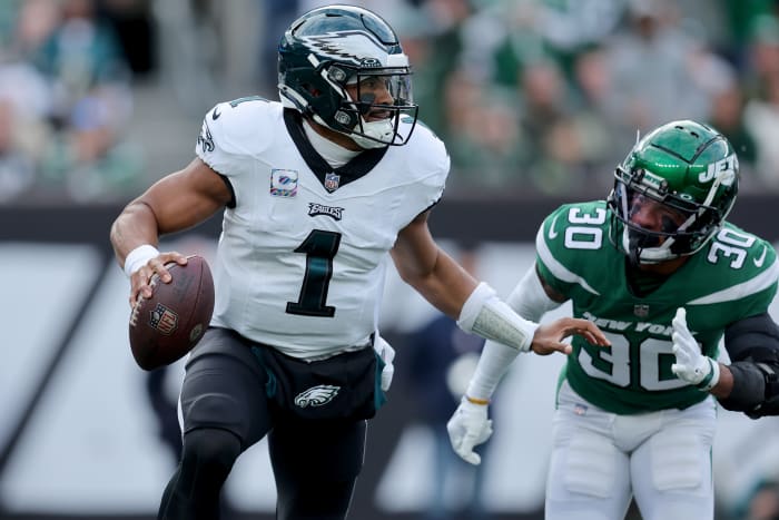 Philadelphia Eagles quarterback Jalen Hurts (1) drops back to pass against New York Jets cornerback Michael Carter II (30) during the first quarter at MetLife Stadium.